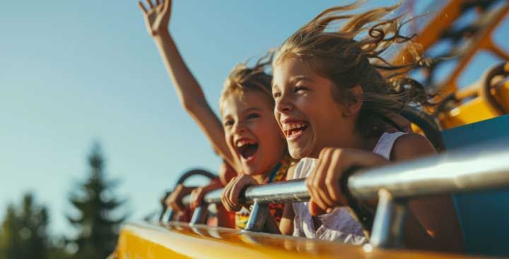 Children enjoying theme park ride