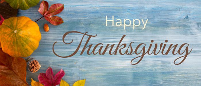 Thanksgiving banner with leaves, pumpkins, and acorns.