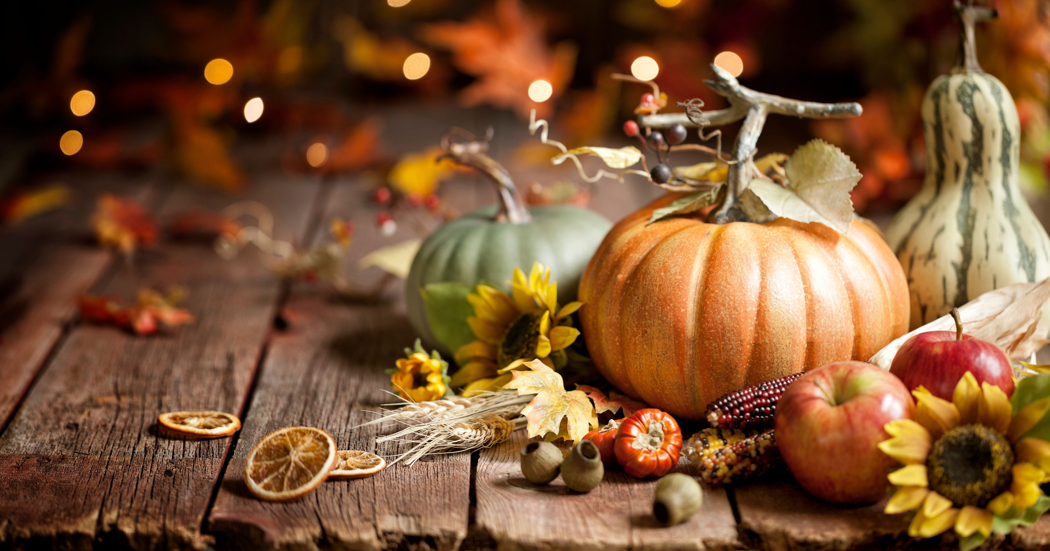 Fall image of pumpkins, fruit, and leaves
