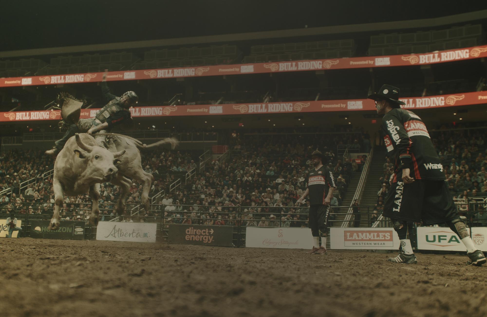 A bull rider in the arena at Rogers Place