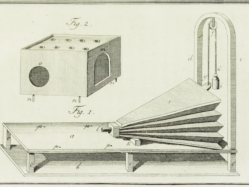 Copperplate engraving of the parts of a speaking machine: a box with a round mouth opening, and a folding bellows on a wooden frame