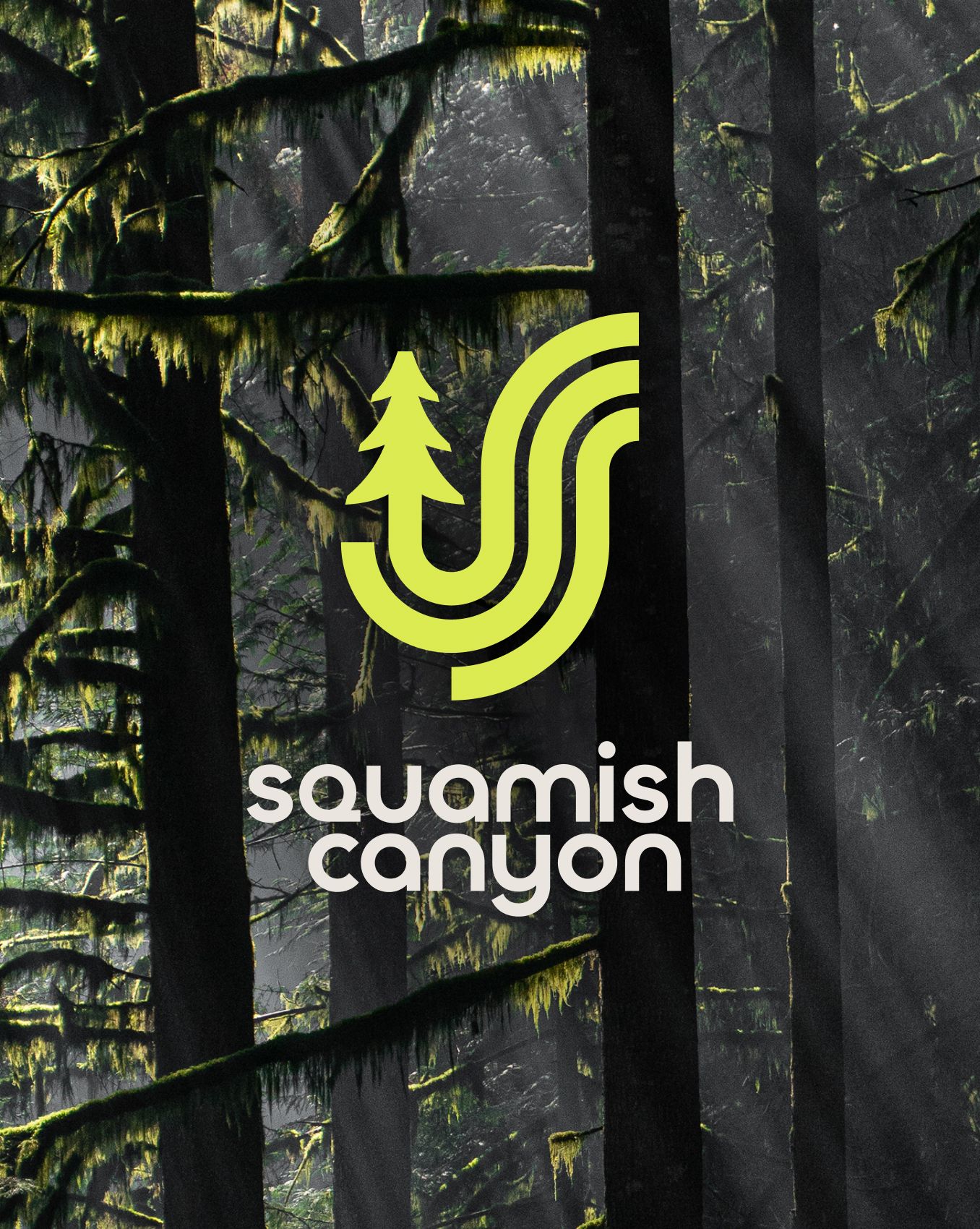 The Squamish Canyon logo over a misty rainforest