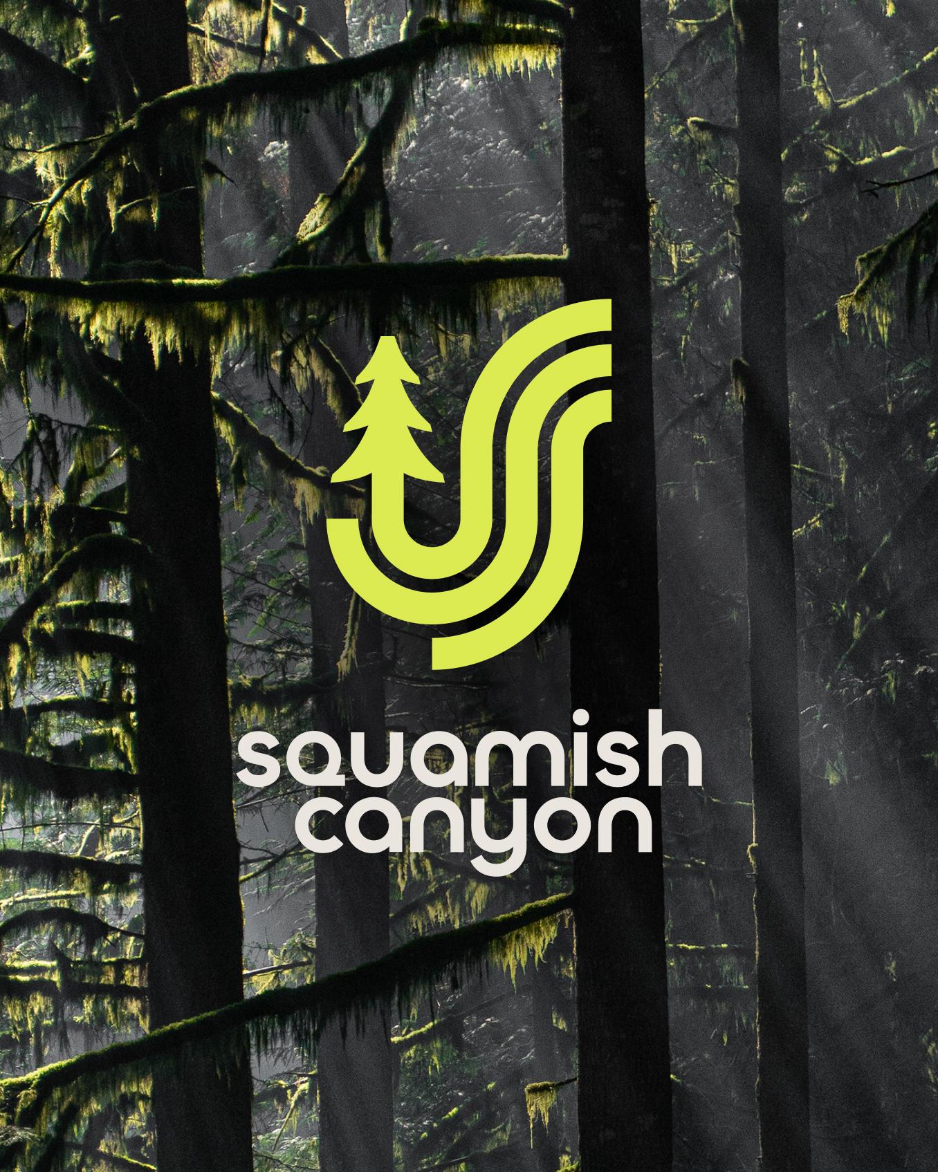 The Squamish Canyon logo over a misty rainforest