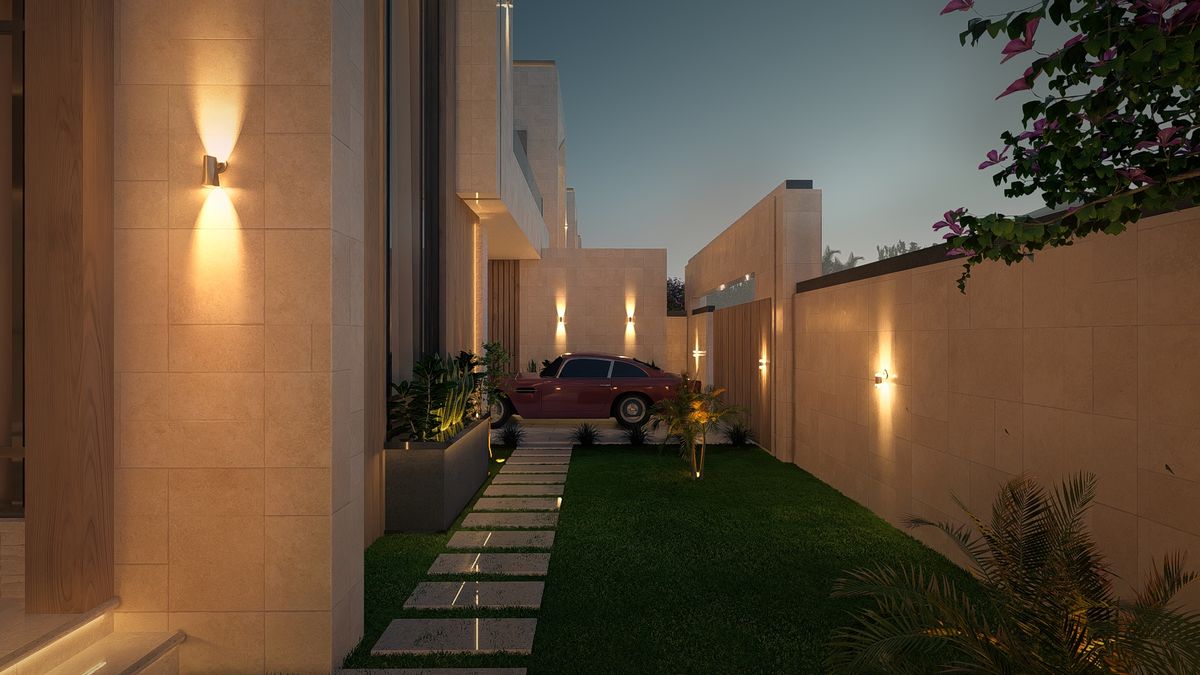 الممرّ الجانبي والعشب بين ألواح الرصف مساءً