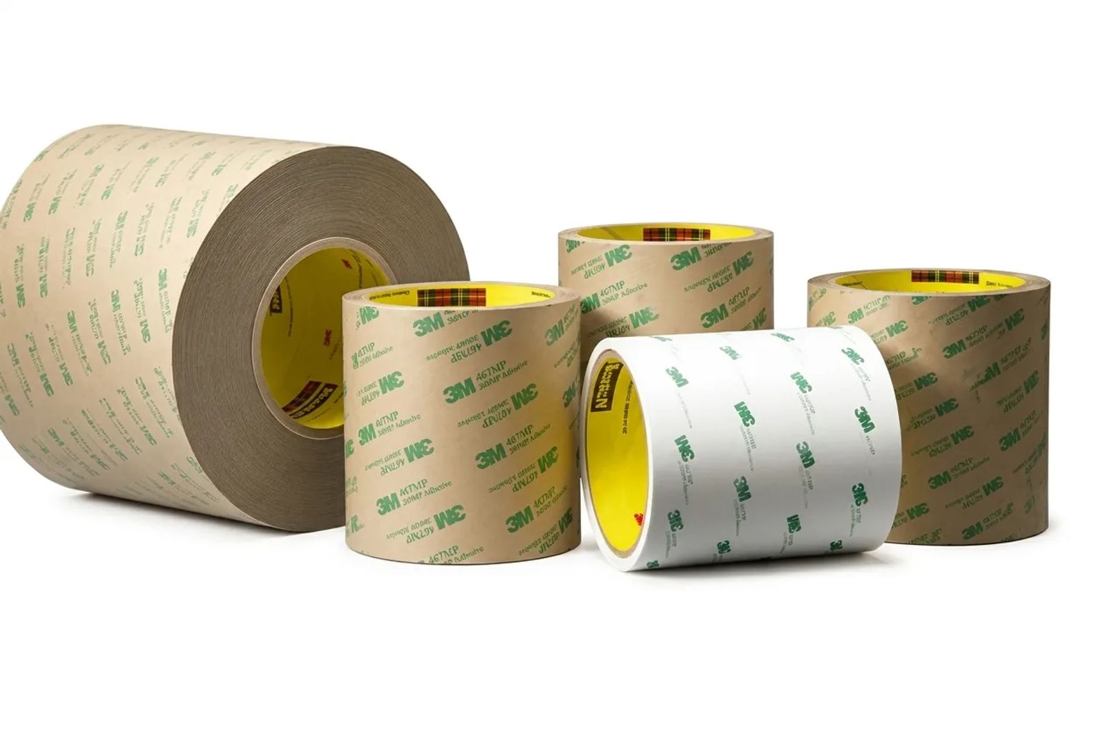 Rolls of 3M 467MP pressure-sensitive adhesive transfer tape on a clean white background.