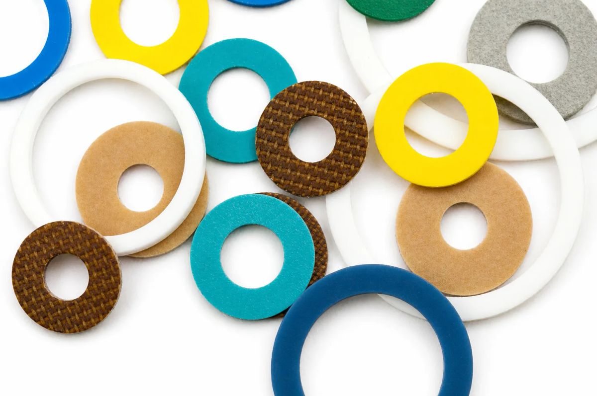 Assorted custom plastic washers in various colors and materials