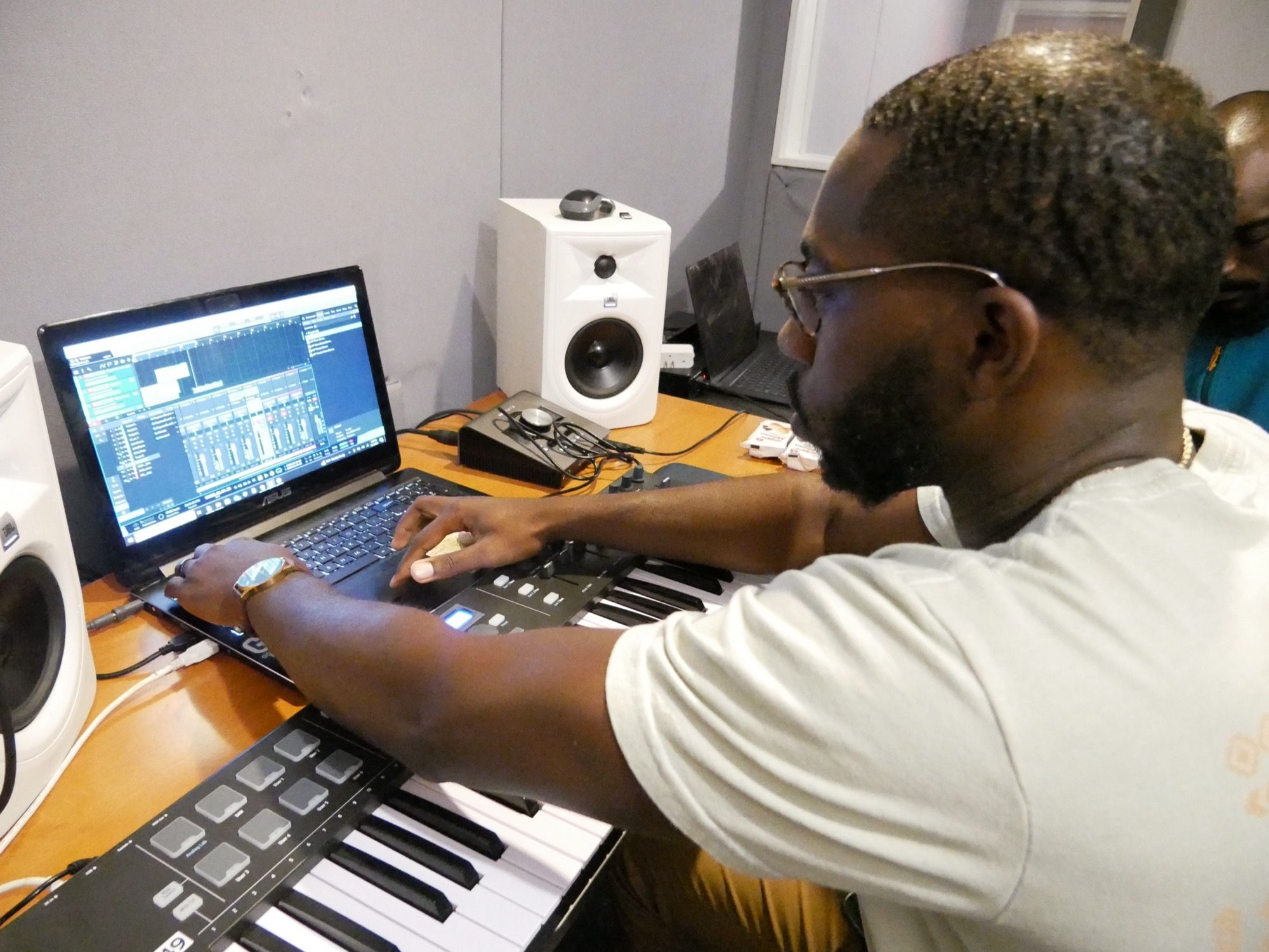Producer building a beat on the keys