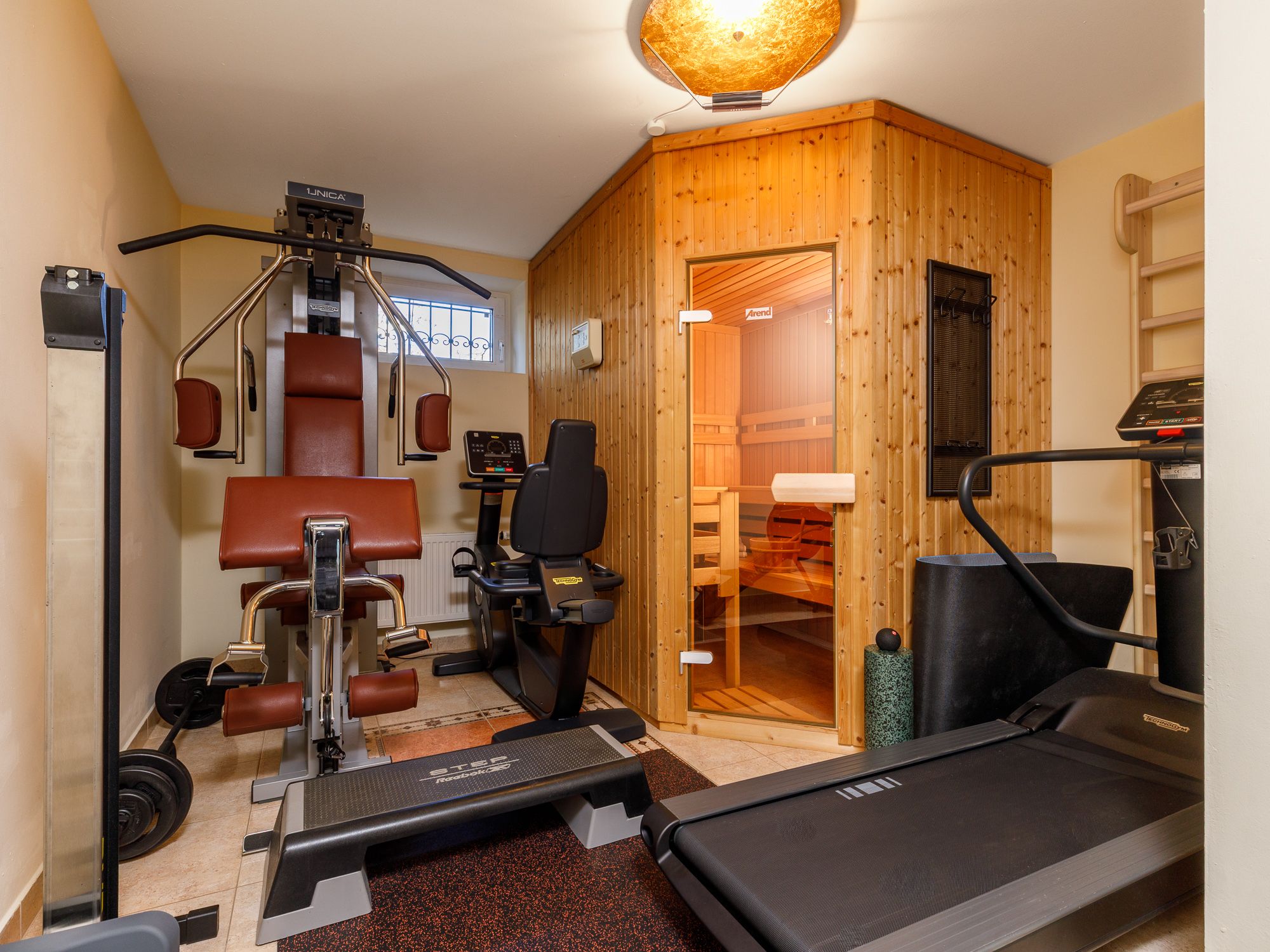 Spacious fitness area with Finnish sauna