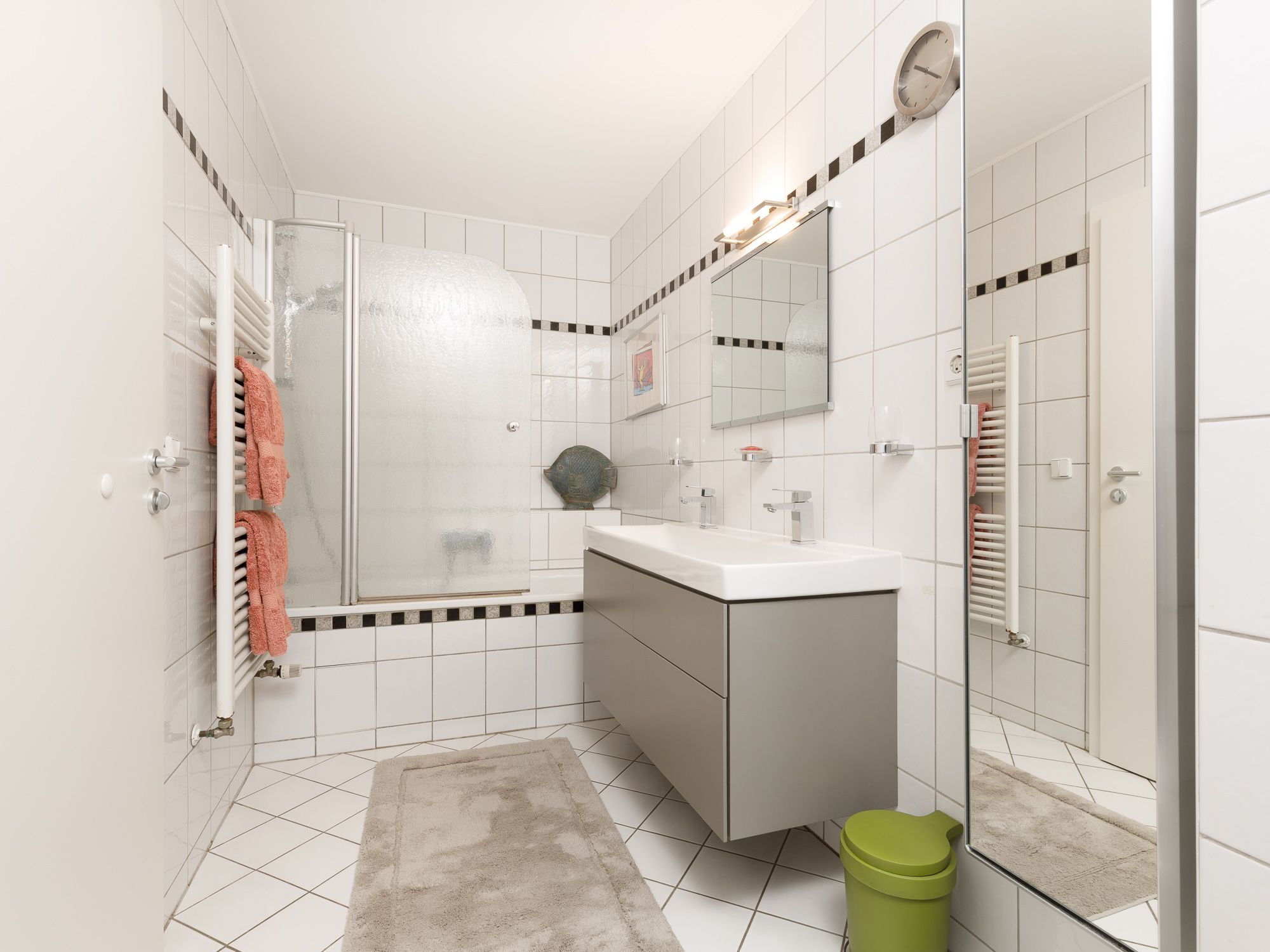Bathroom with bathtub and double vanity 