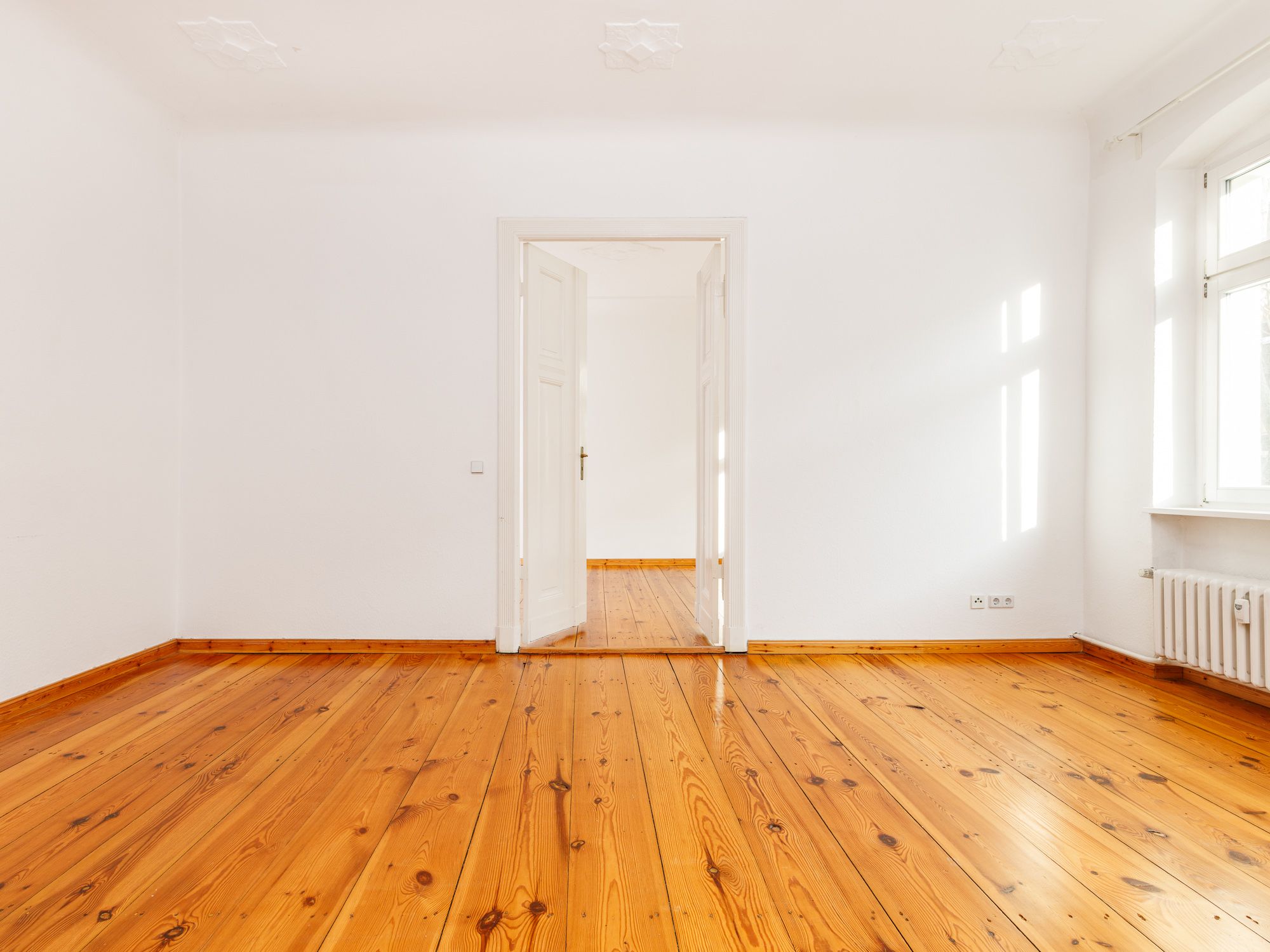 Living room with floor boards and historic ambiance 