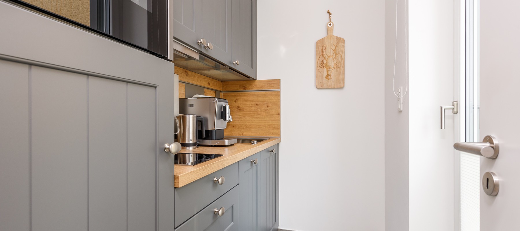 Separate kitchen area with modern appliances Separate kitchen area with modern appliances