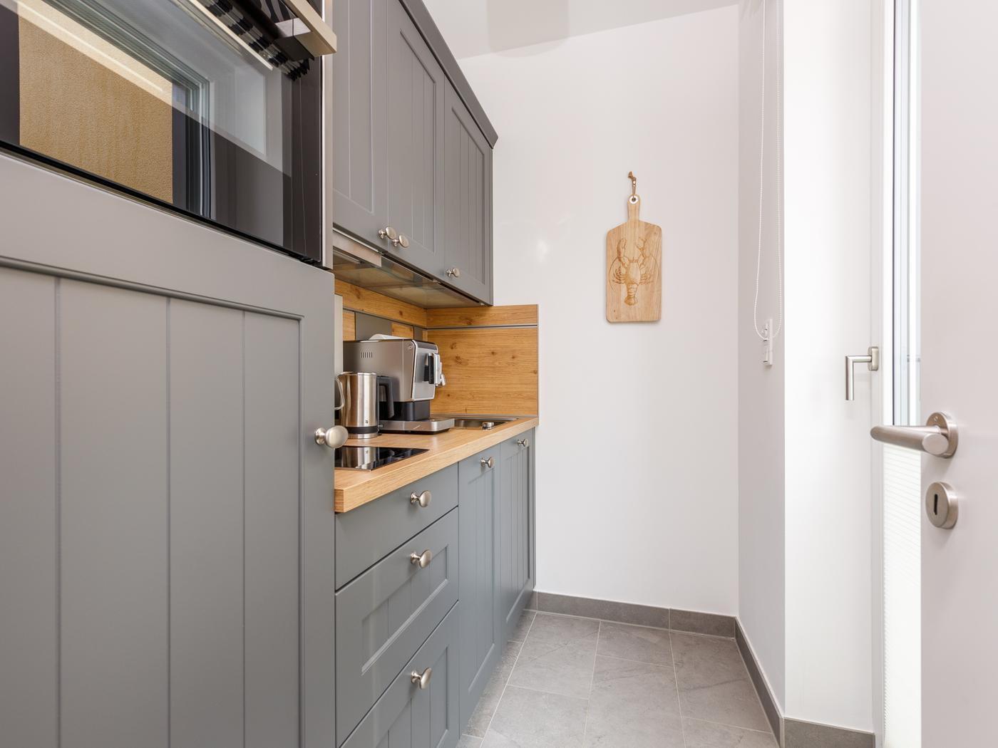 Separater Küchenbereich mit moderner Ausstattung Separater Küchenbereich mit moderner Ausstattung