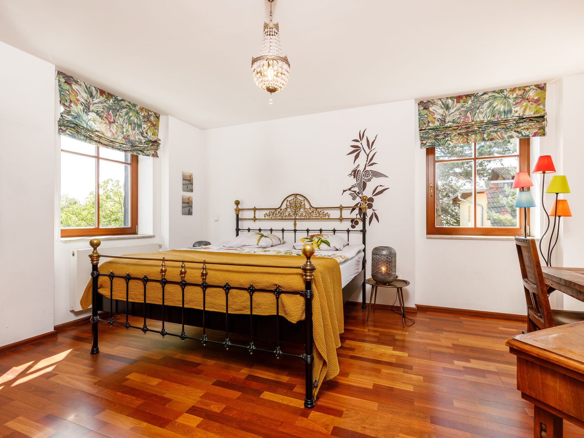Spacious master bedroom with a view of the countryside