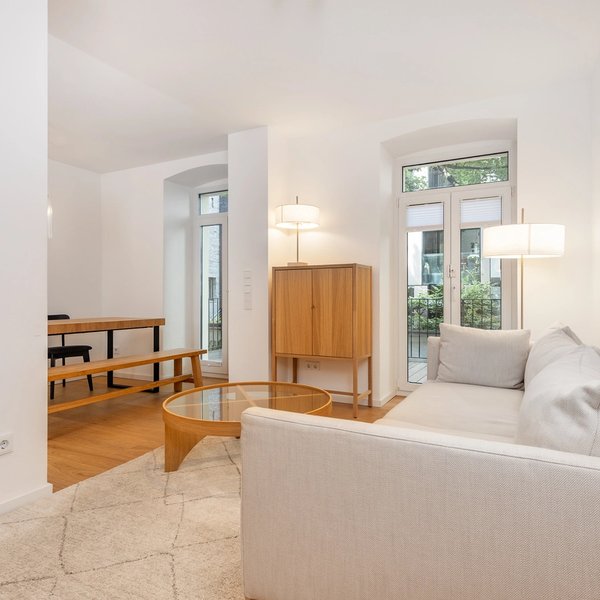 living room sofa coffee table windows rug