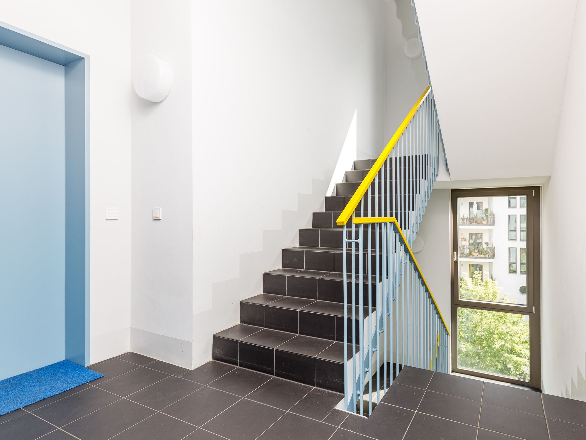 Staircase with tiled flooring 