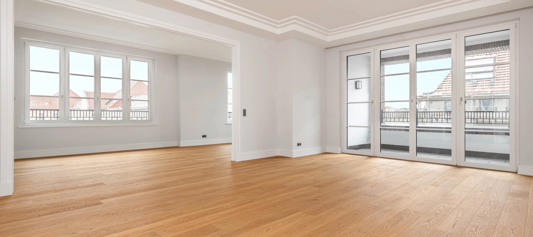 Light-flooded and open living room with high-quality floorboards Light-flooded and open living room with high-quality floorboards