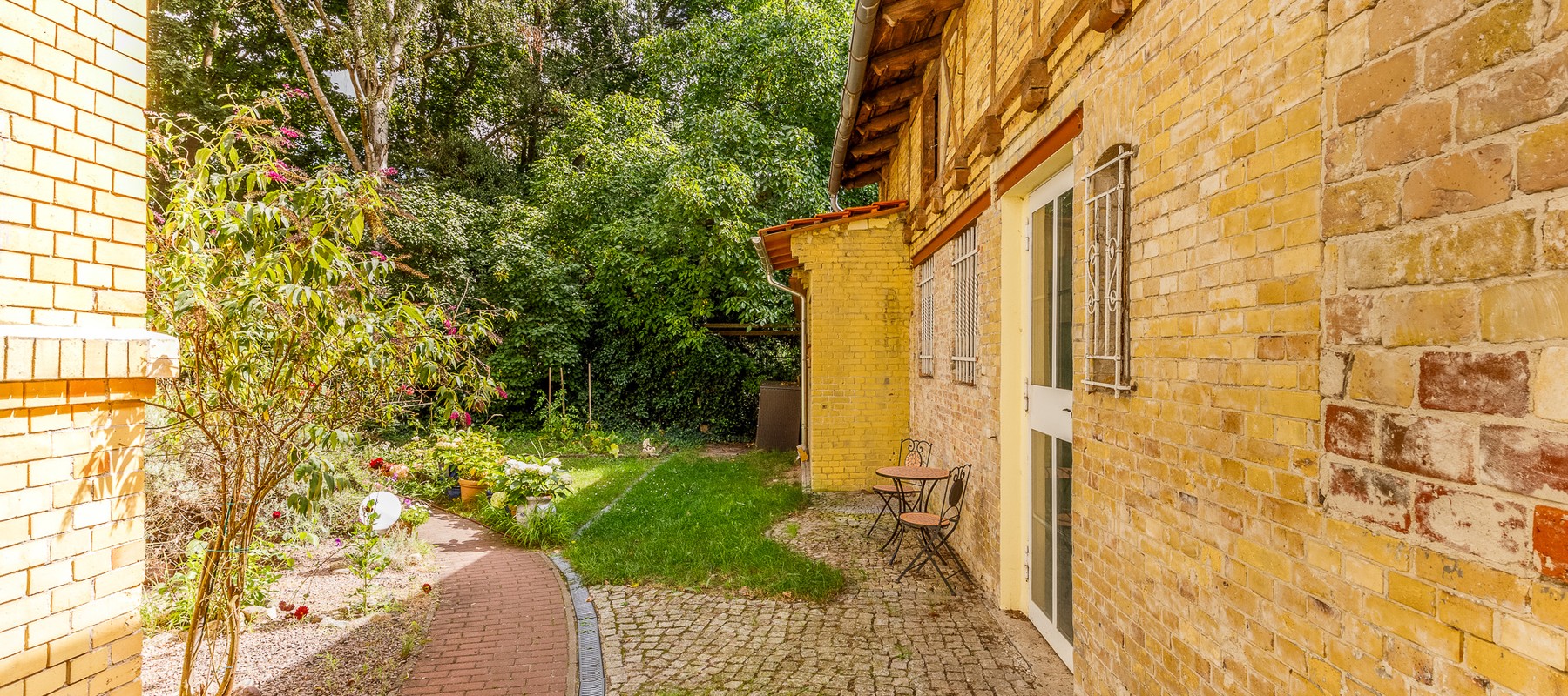 Entrance area with terrace and garden Entrance area with terrace and garden