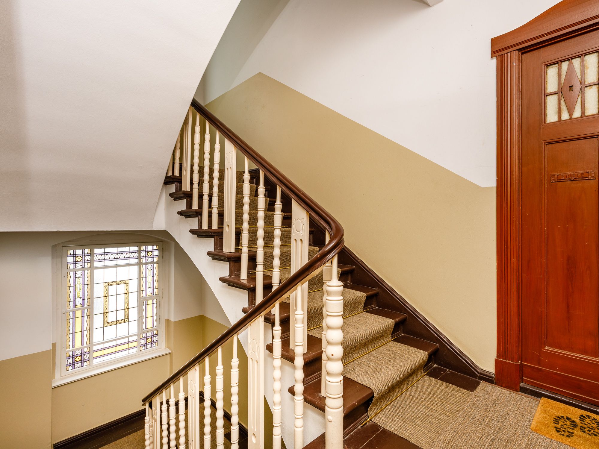 Stylish staircase with stucco ornaments 