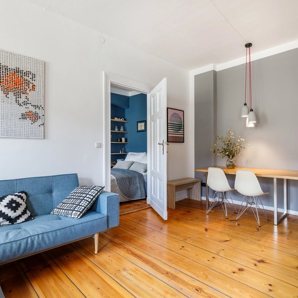 Living area sofa dining table hardwood floor