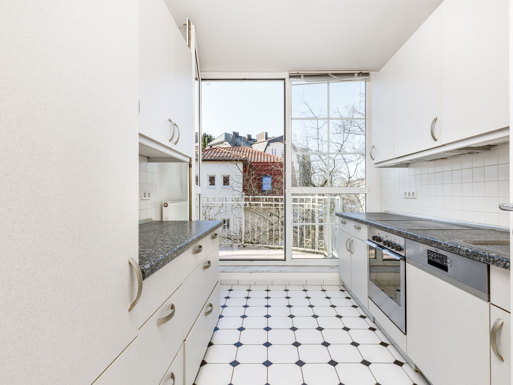 Separate kitchen area with appliances 