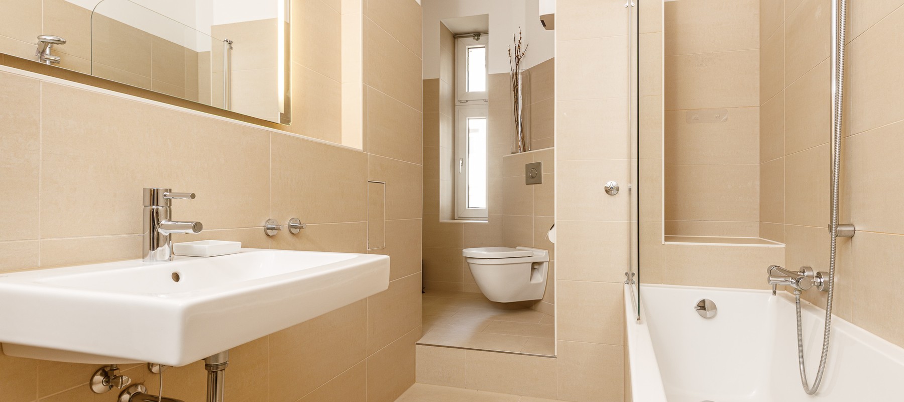 Modern, daylit bathroom with bathtub and shower Modern, daylit bathroom with bathtub and shower