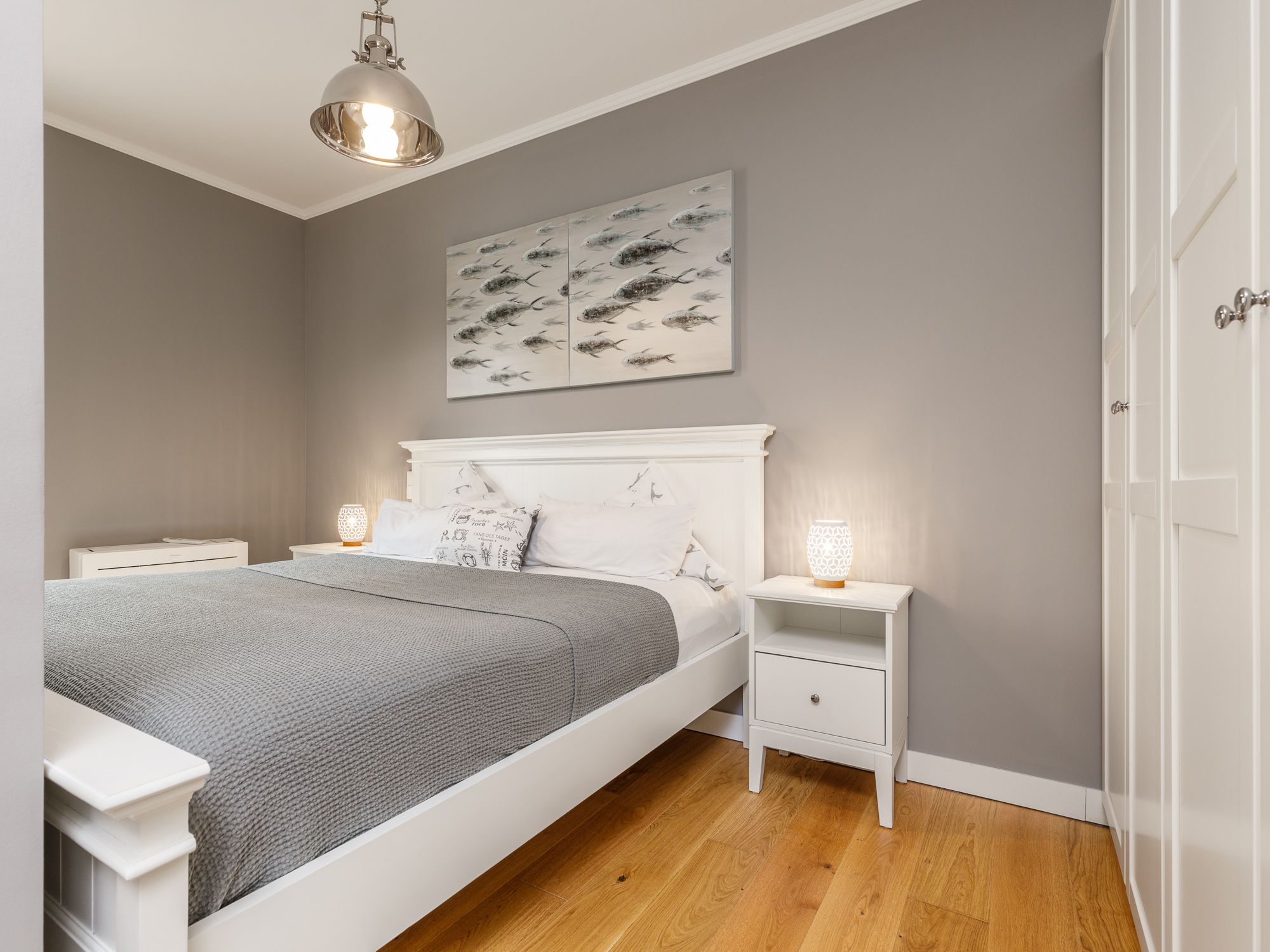 Sleeping area with bed and wardrobe 