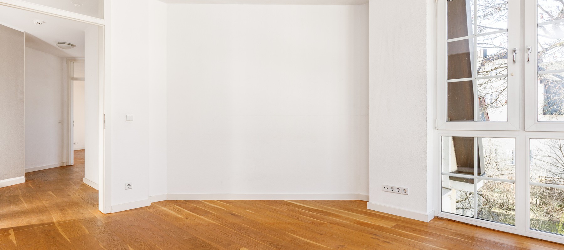 Open dining and living area with parquet floor Open dining and living area with parquet floor