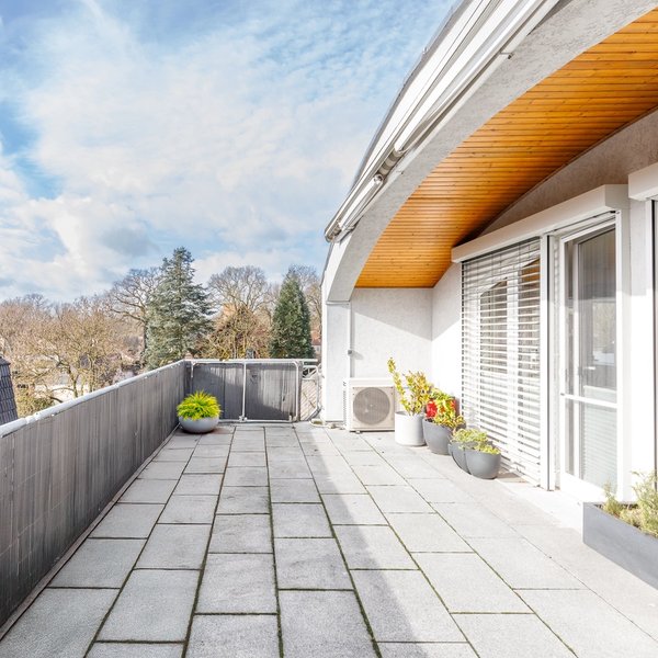 Rooftop terrace tiled flooring railing planters outdoor area