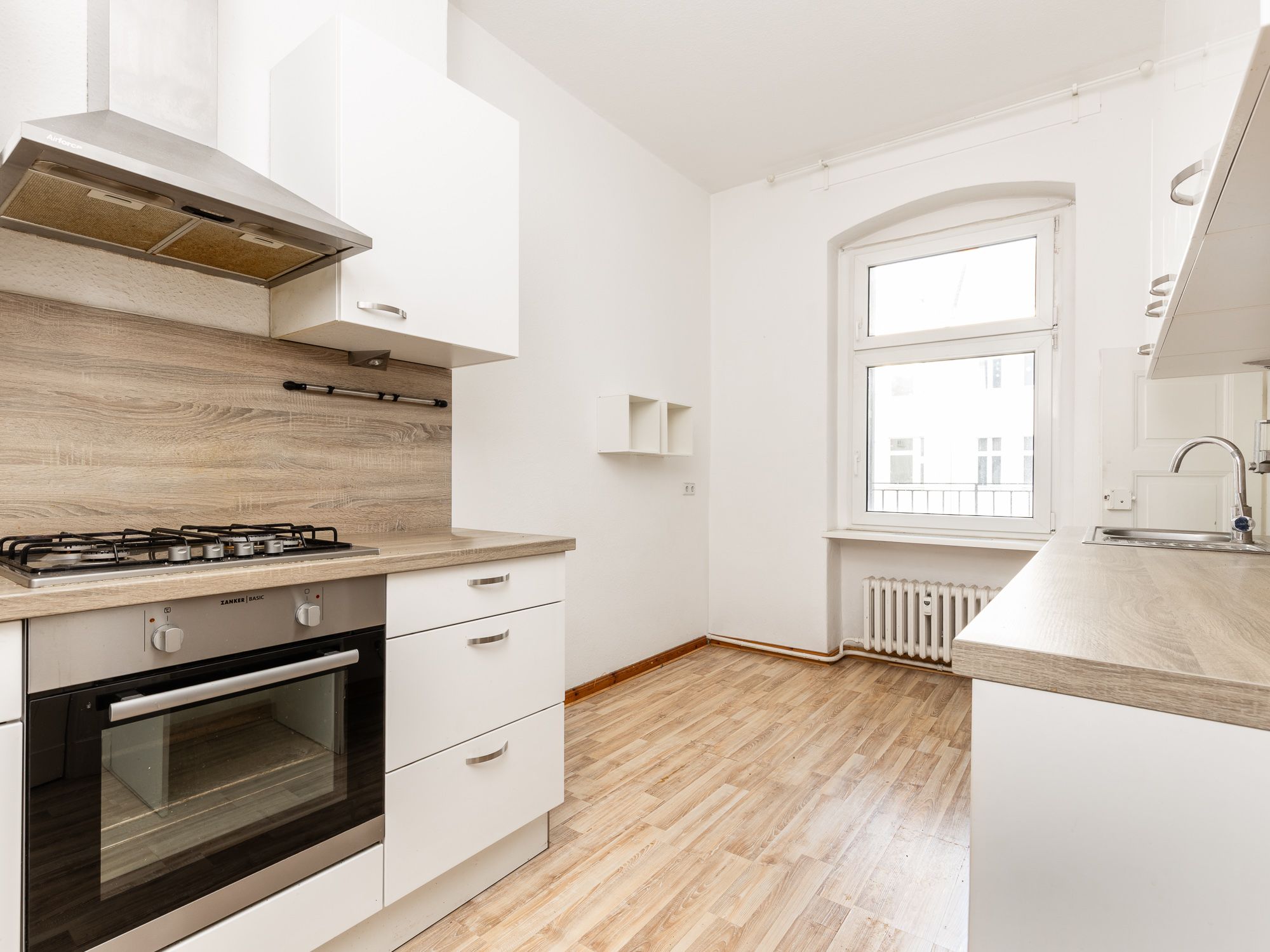 Separate kitchen area with appliances 