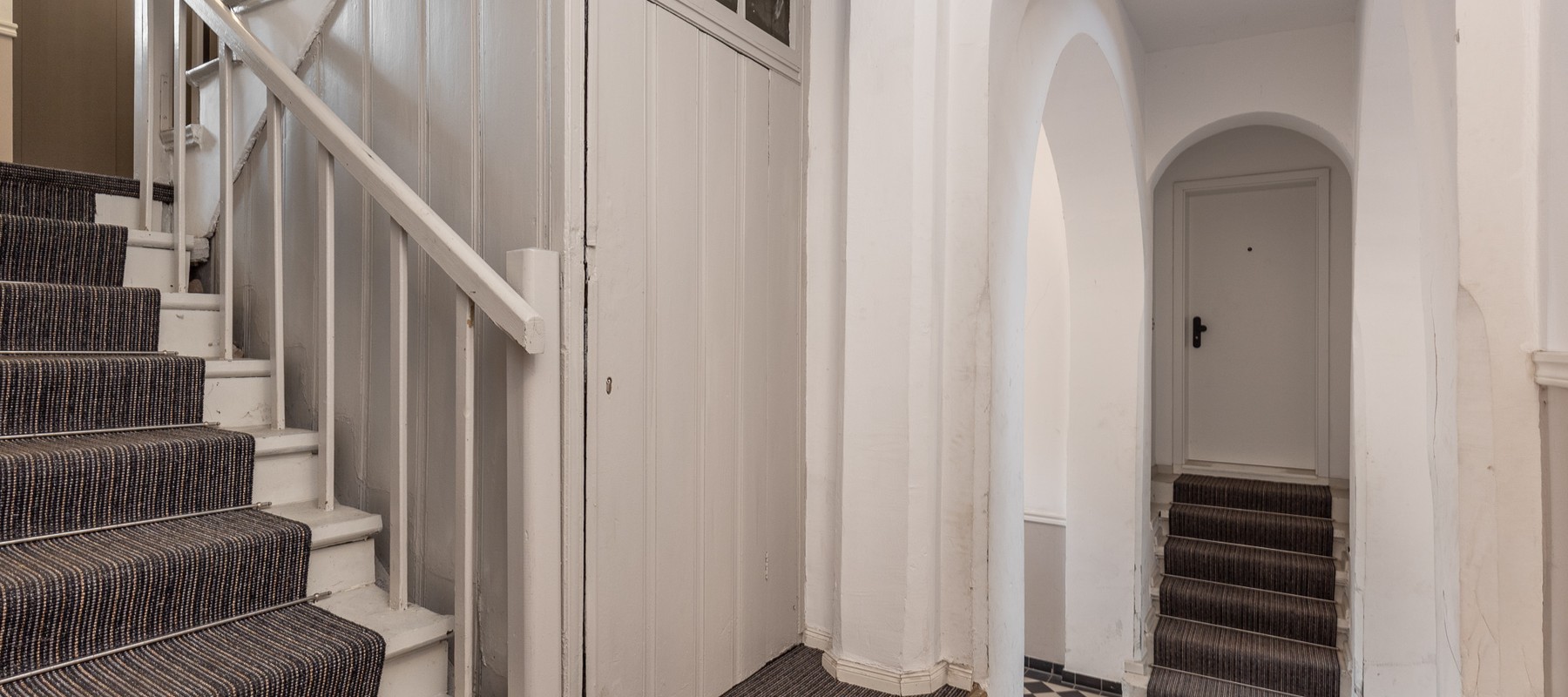 Well-maintained hallway with sisal carpet Well-maintained hallway with sisal carpet
