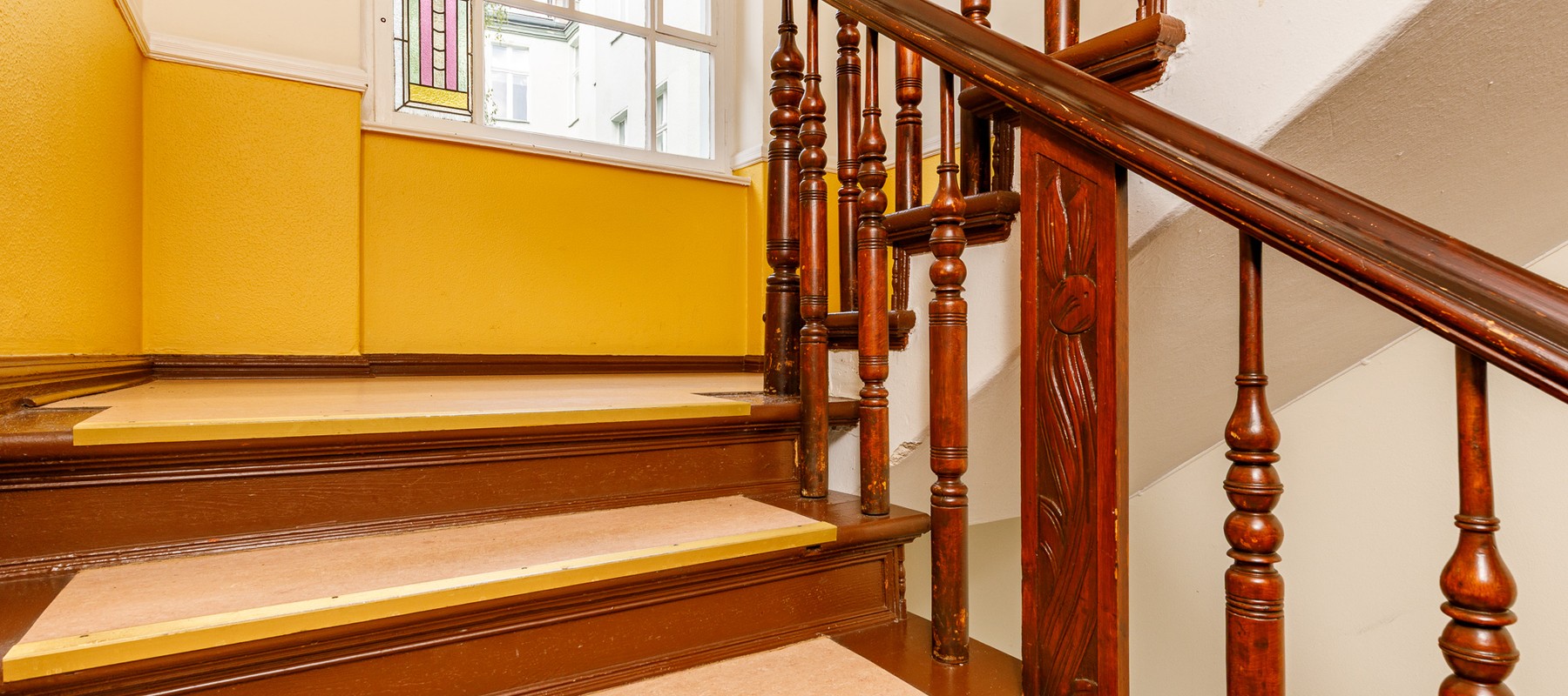 Well-maintained staircase with stylish railings Well-maintained staircase with stylish railings