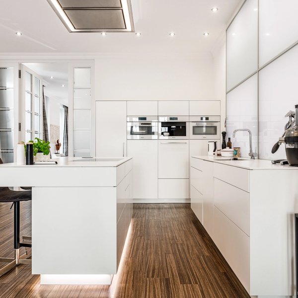 Modern kitchen with counter and brand-name appliances