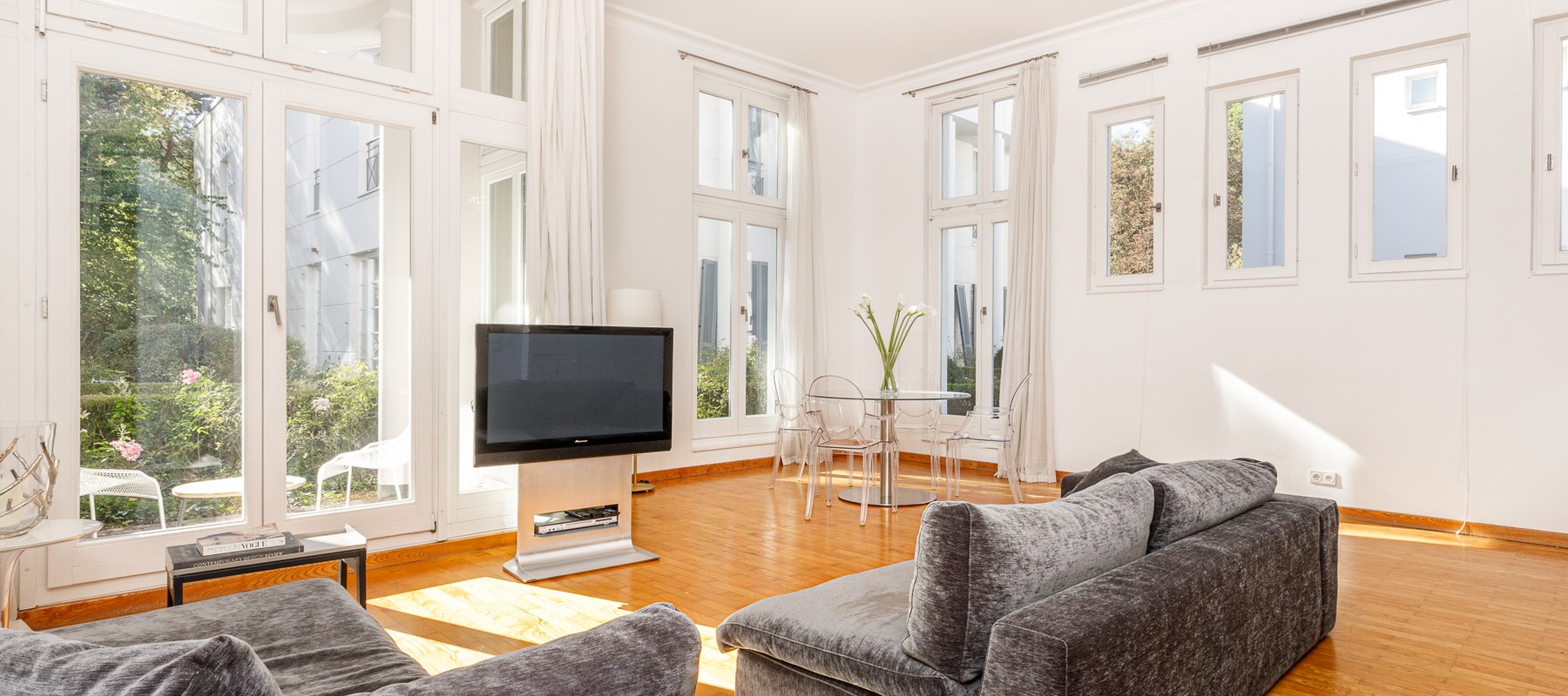 Open-plan living and dining area with balcony Open-plan living and dining area with balcony