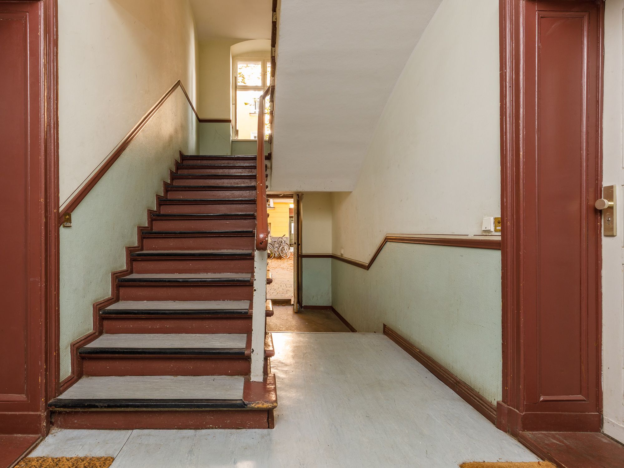 Well-maintained staircase with linoleum flooring