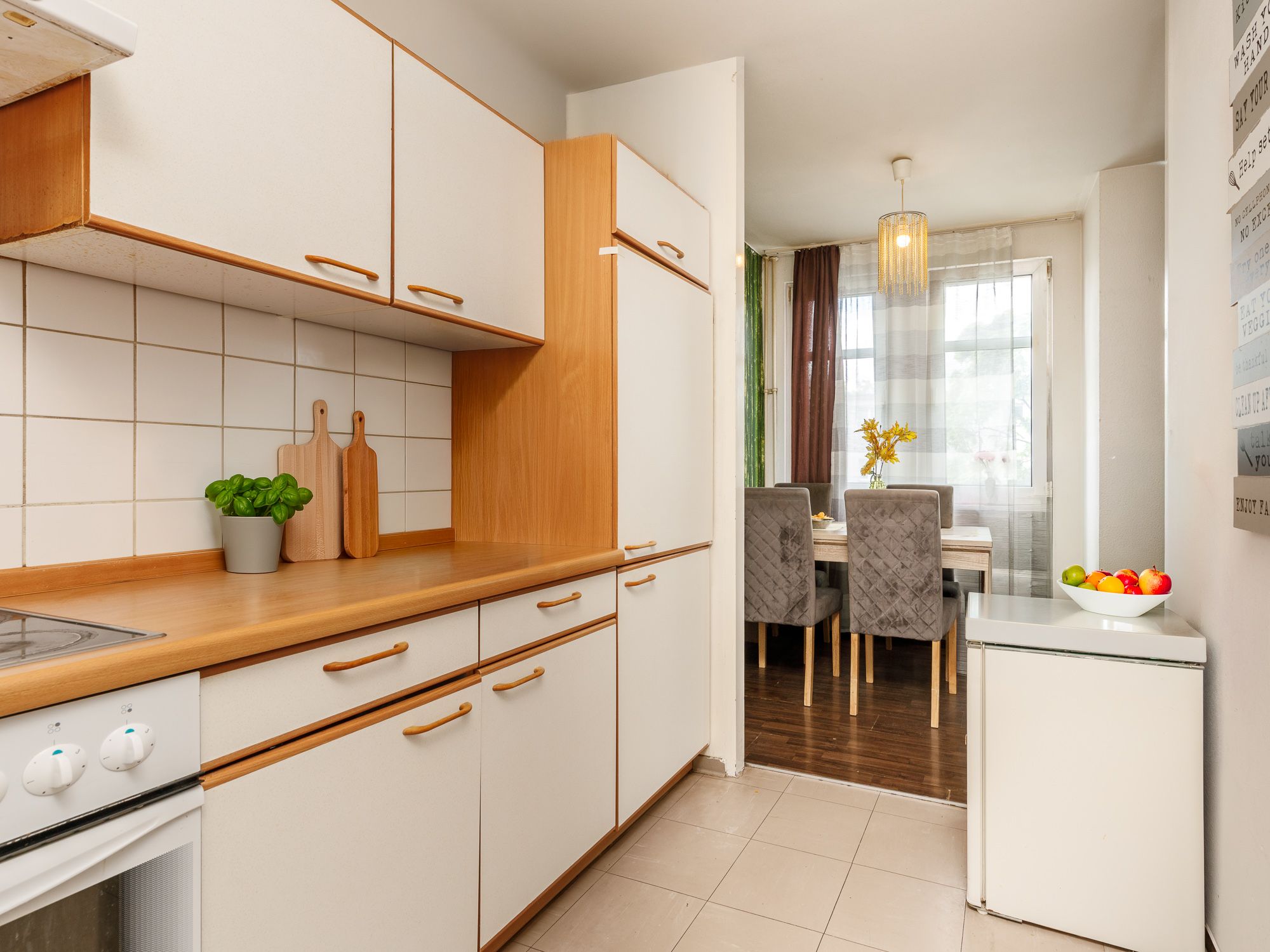 Partially-open kitchen area with appliances 