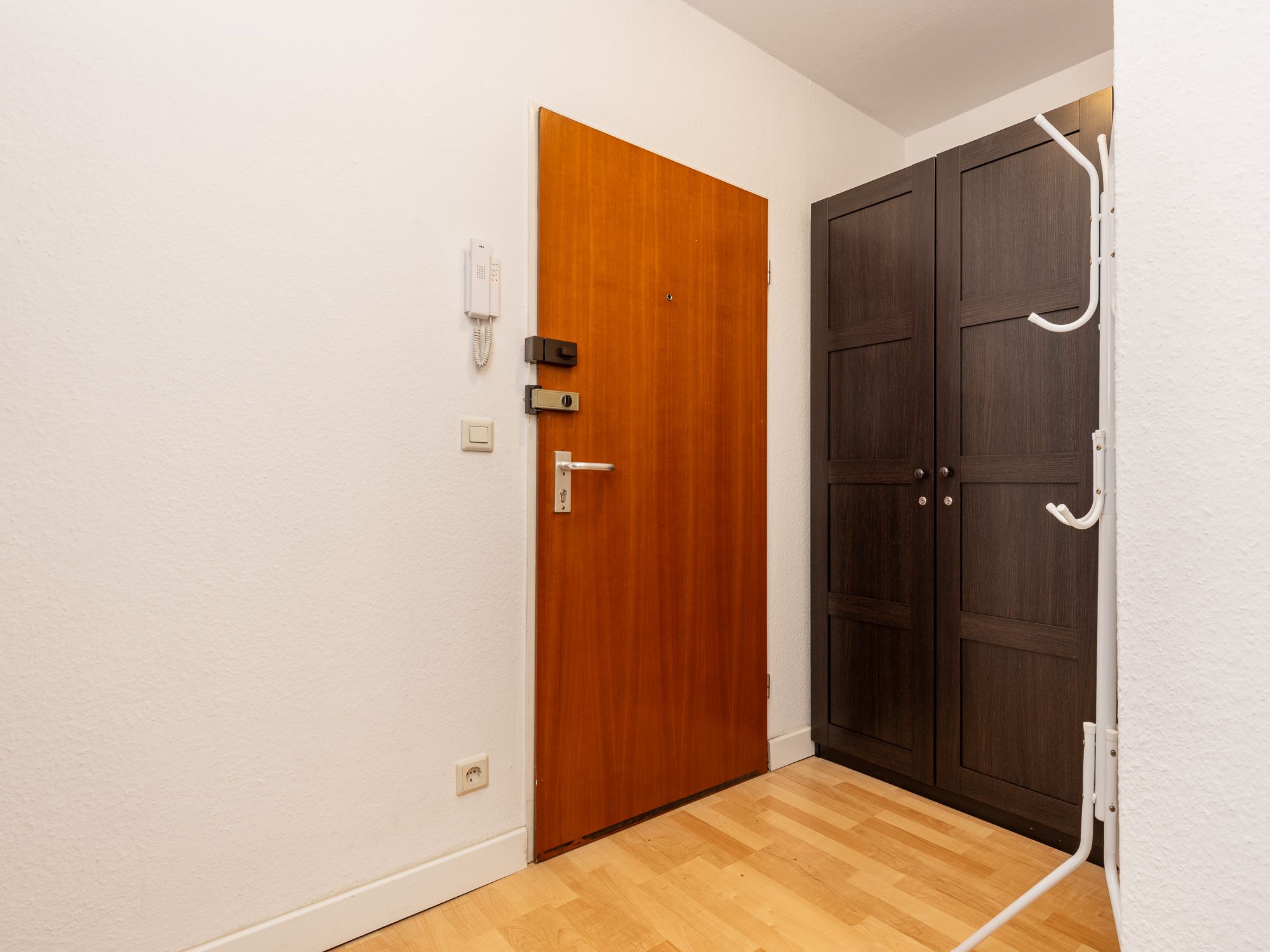 Entrance area with intercom system and security lock 