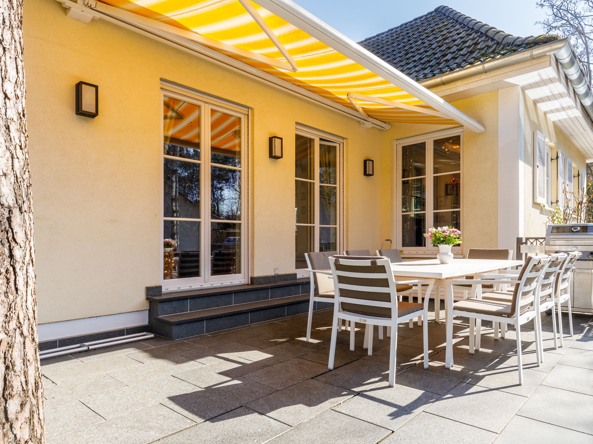 Sunlit terrace with garden access 