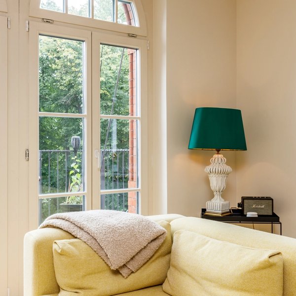living room balcony access arched windows