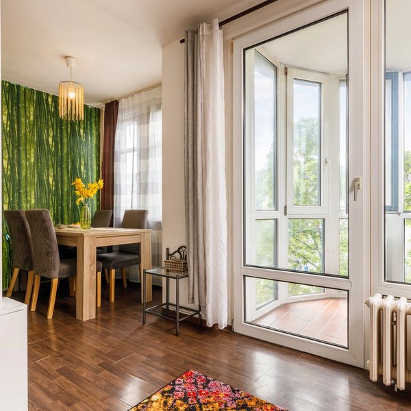 Dining area table chairs window parquet