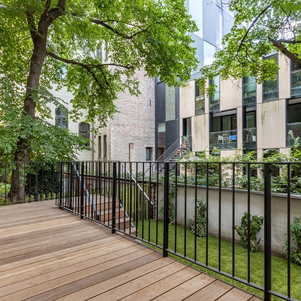 terrace wooden deck railing courtyard trees