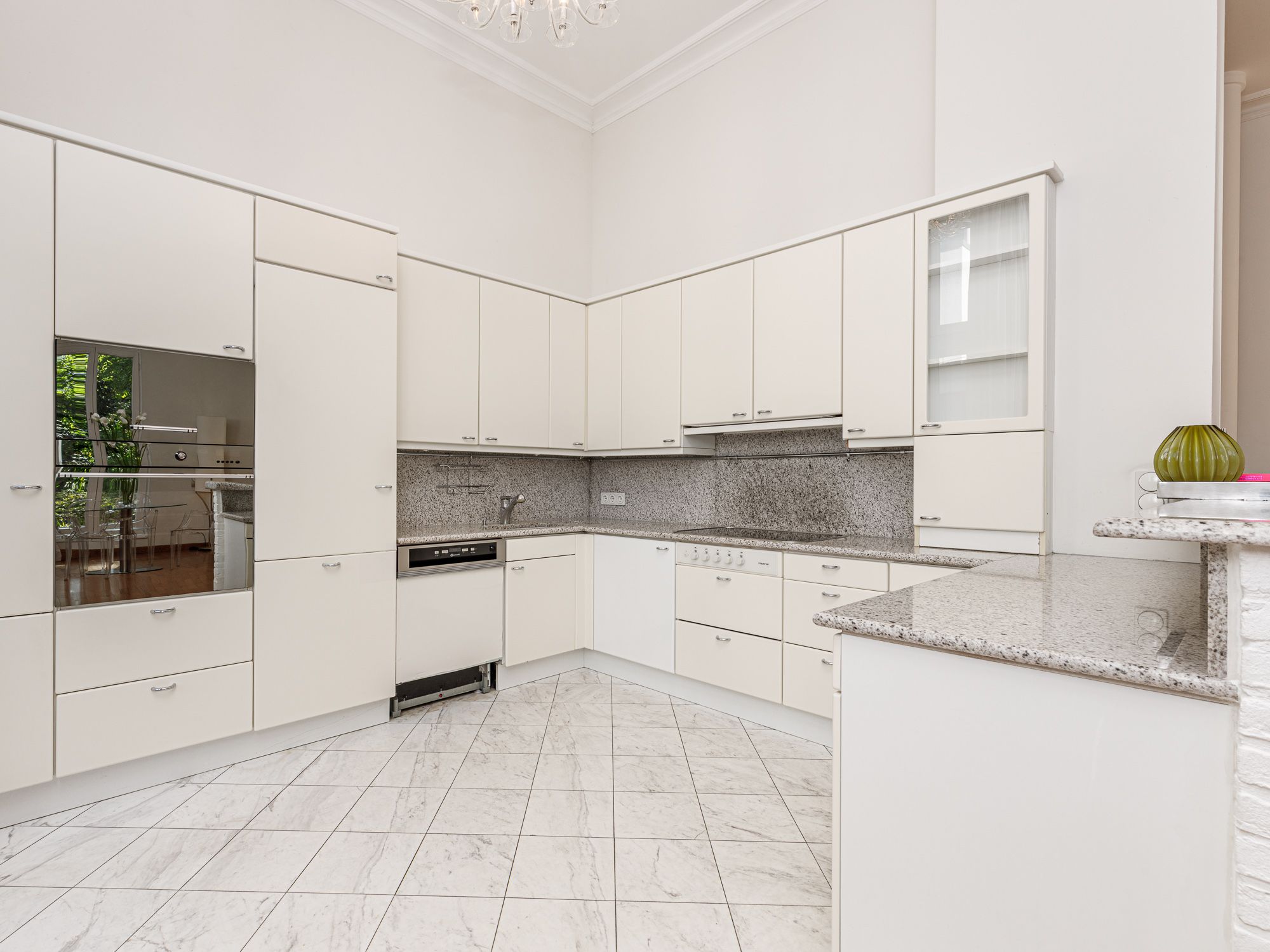 Kitchen with steam cooker, oven, and cooking island 