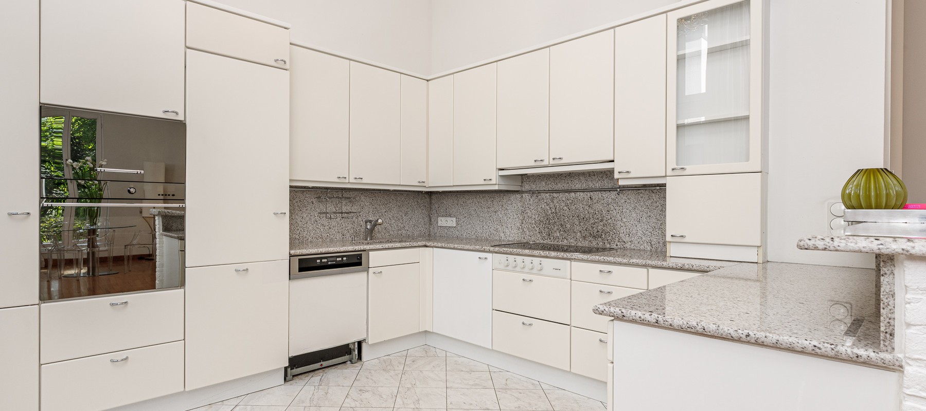 Kitchen with steam cooker, oven, and cooking island Kitchen with steam cooker, oven, and cooking island