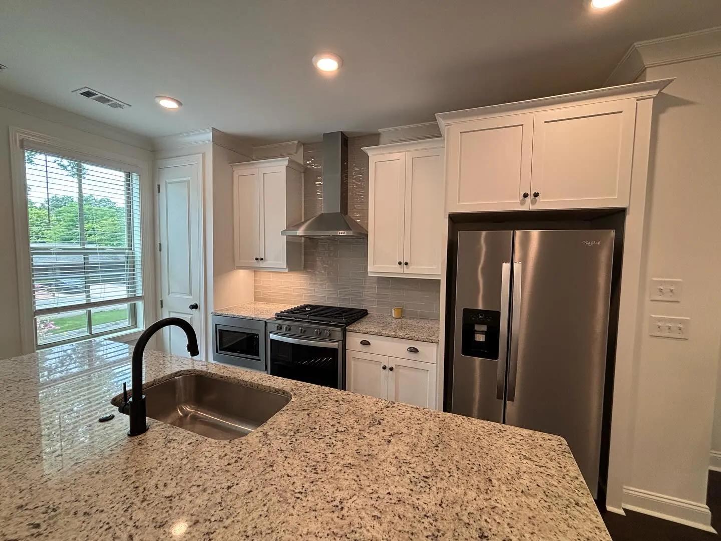 Bright white cabinet refresh in Buckhead by OVO Painting