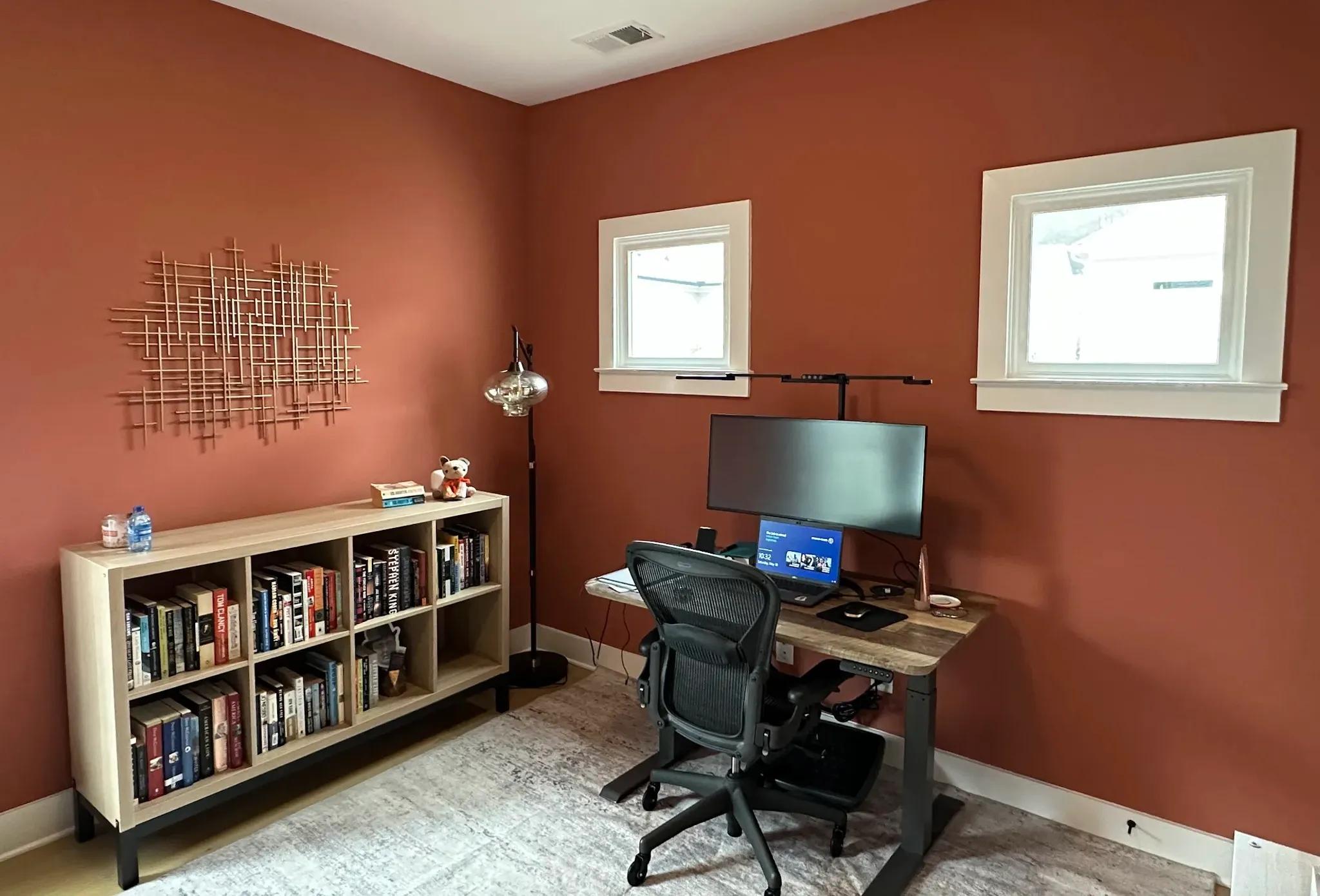 Warm orange accent walls painted by OVO Painting in Midtown Atlanta