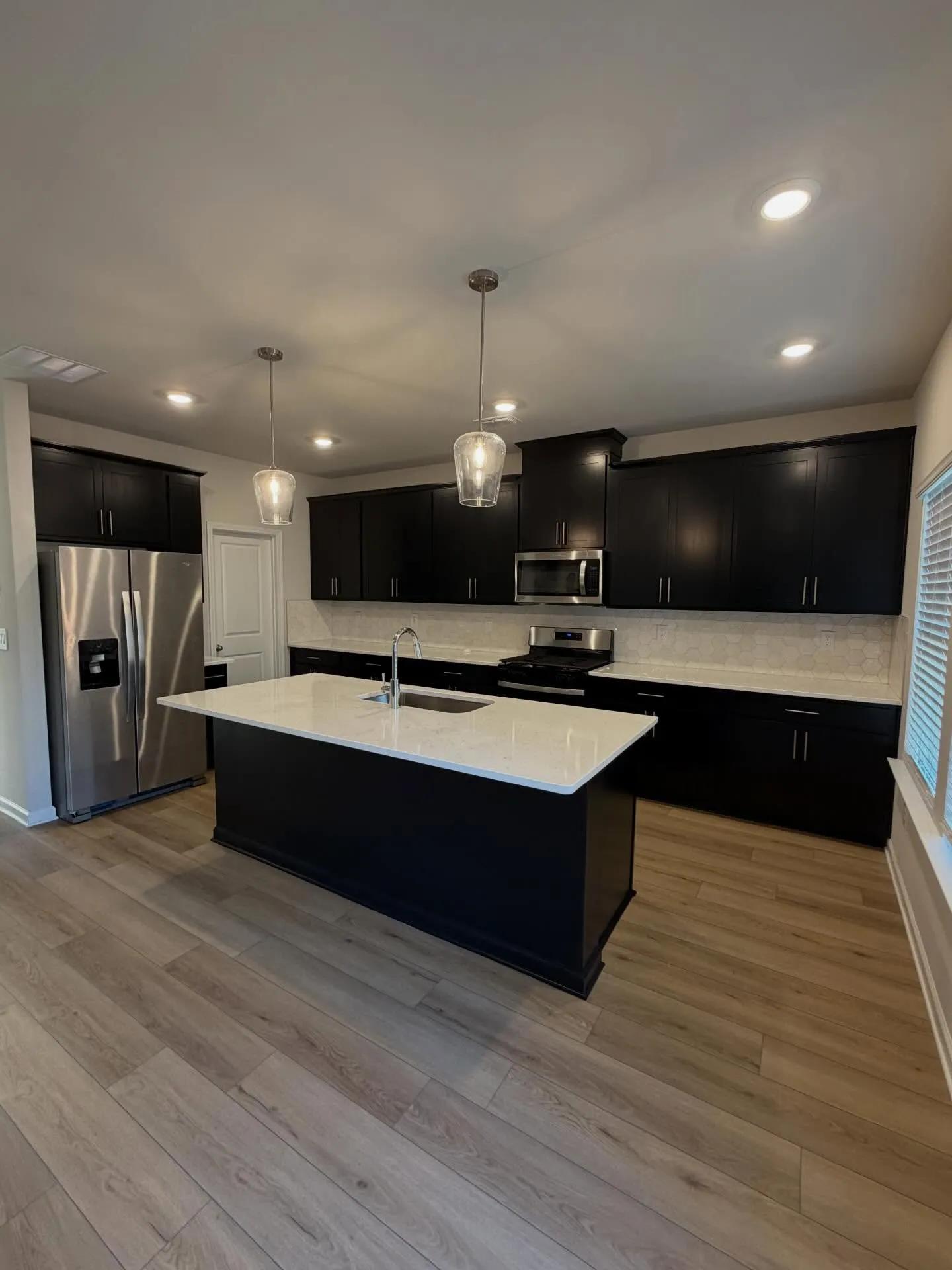 Modern black kitchen cabinets painted by OVO Painting in Atlanta