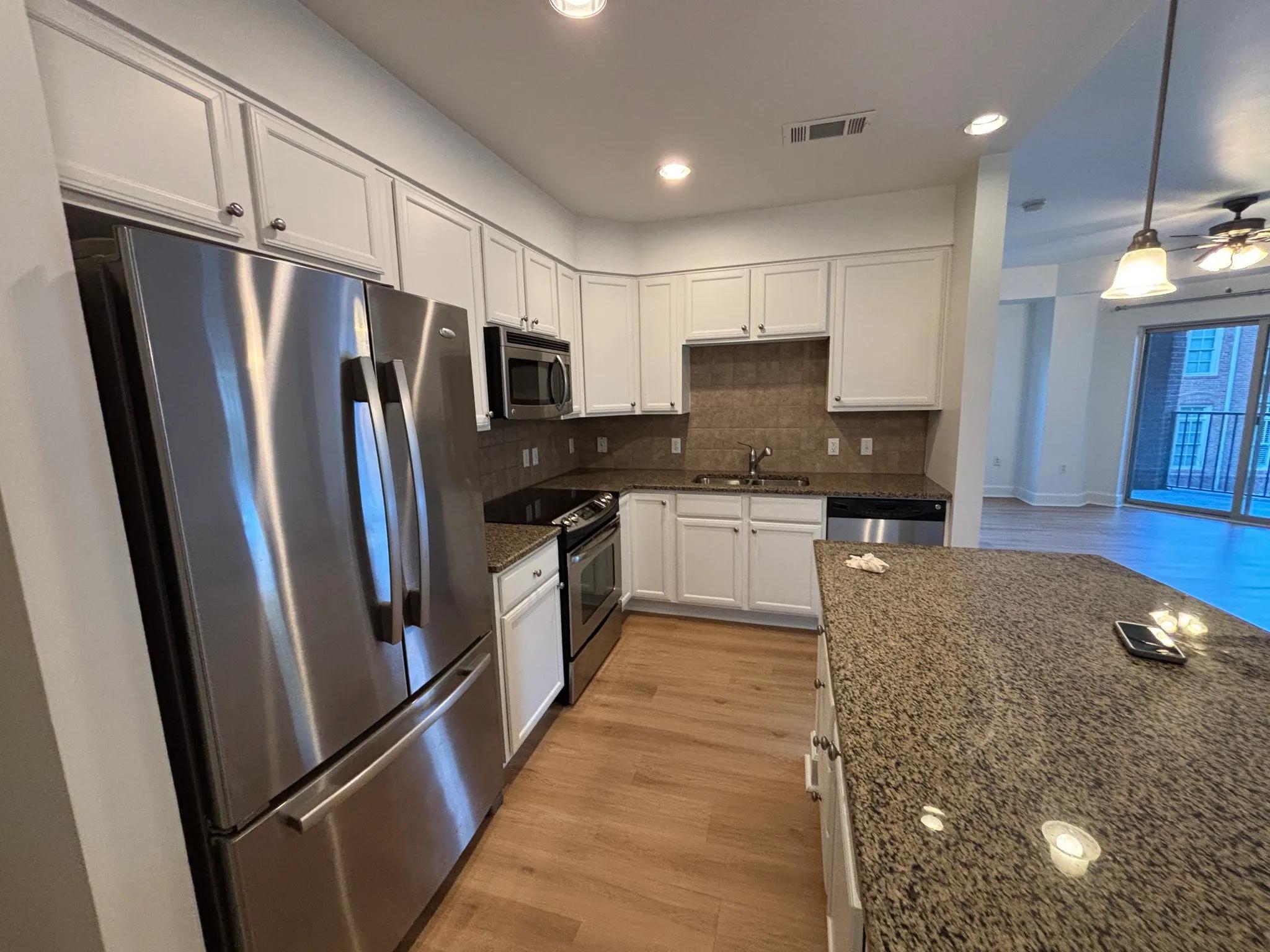 Dark brown cabinets transformed to bright white in Sandy Springs by OVO Painting