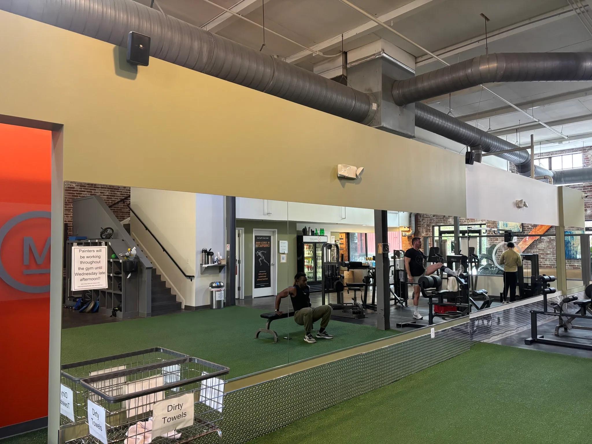 Bold green fitness studio wall painted by OVO Painting in Atlanta