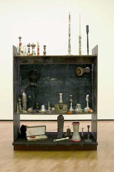 Hany Armanious, Turns in Arabba, 2005, clay, wax, wick, pewter, plaster, polyurethane, wood, formply, peppercorns, silicone, ceramic, drums, speaker, 94 x 79 x 24 in. / 240 × 200 × 60 cm. Installation view, National Sculpture Prize, National Gallery of Australia, Canberra