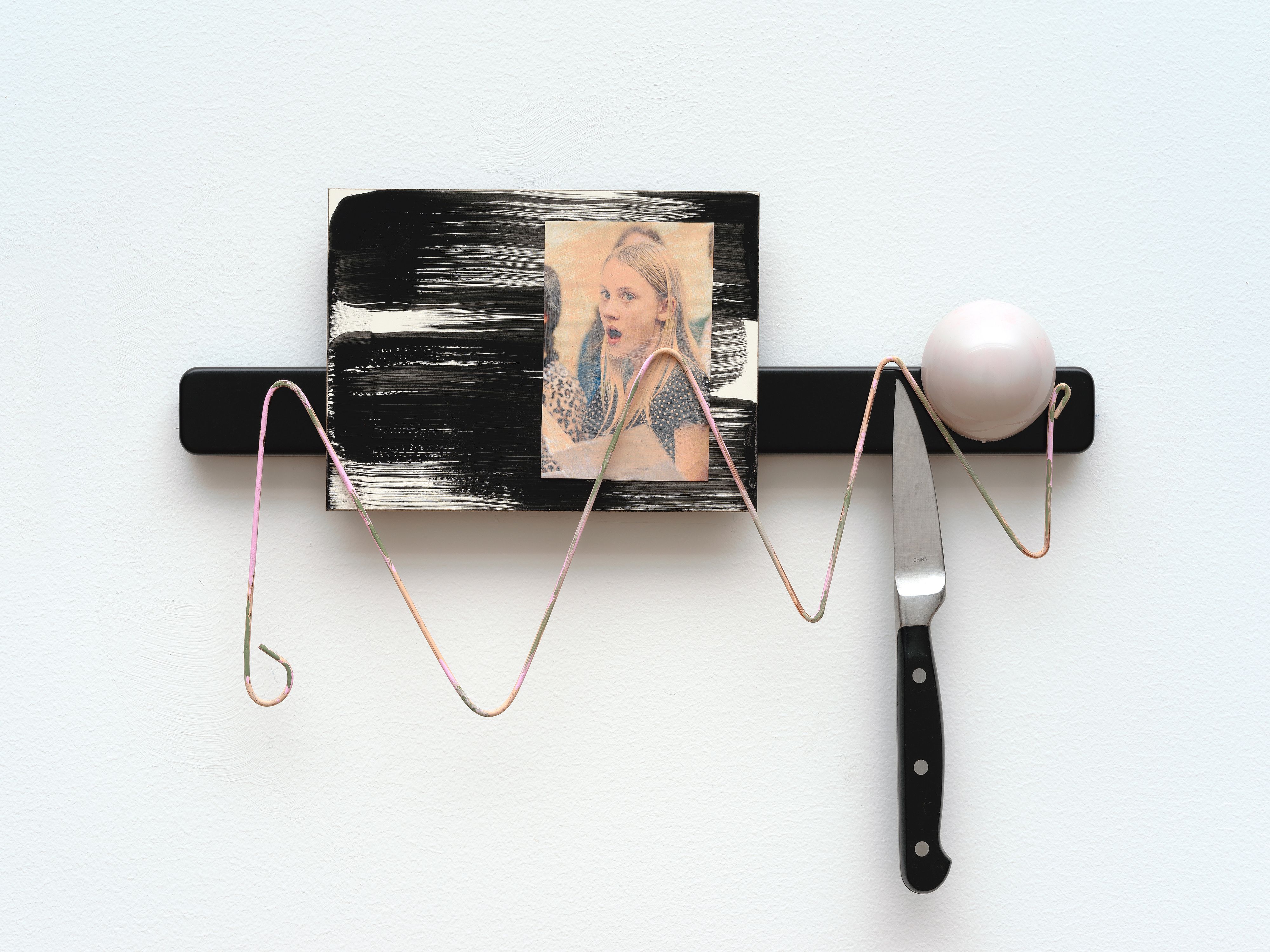 Sara Magenheimer, Paloma, 2016, knife rack, painted steel wire, collaged pigment print on painted clay board, knife, rubber door stop 10 1/2 x 14 1/2 in. (26.67 x 36.83 cm)