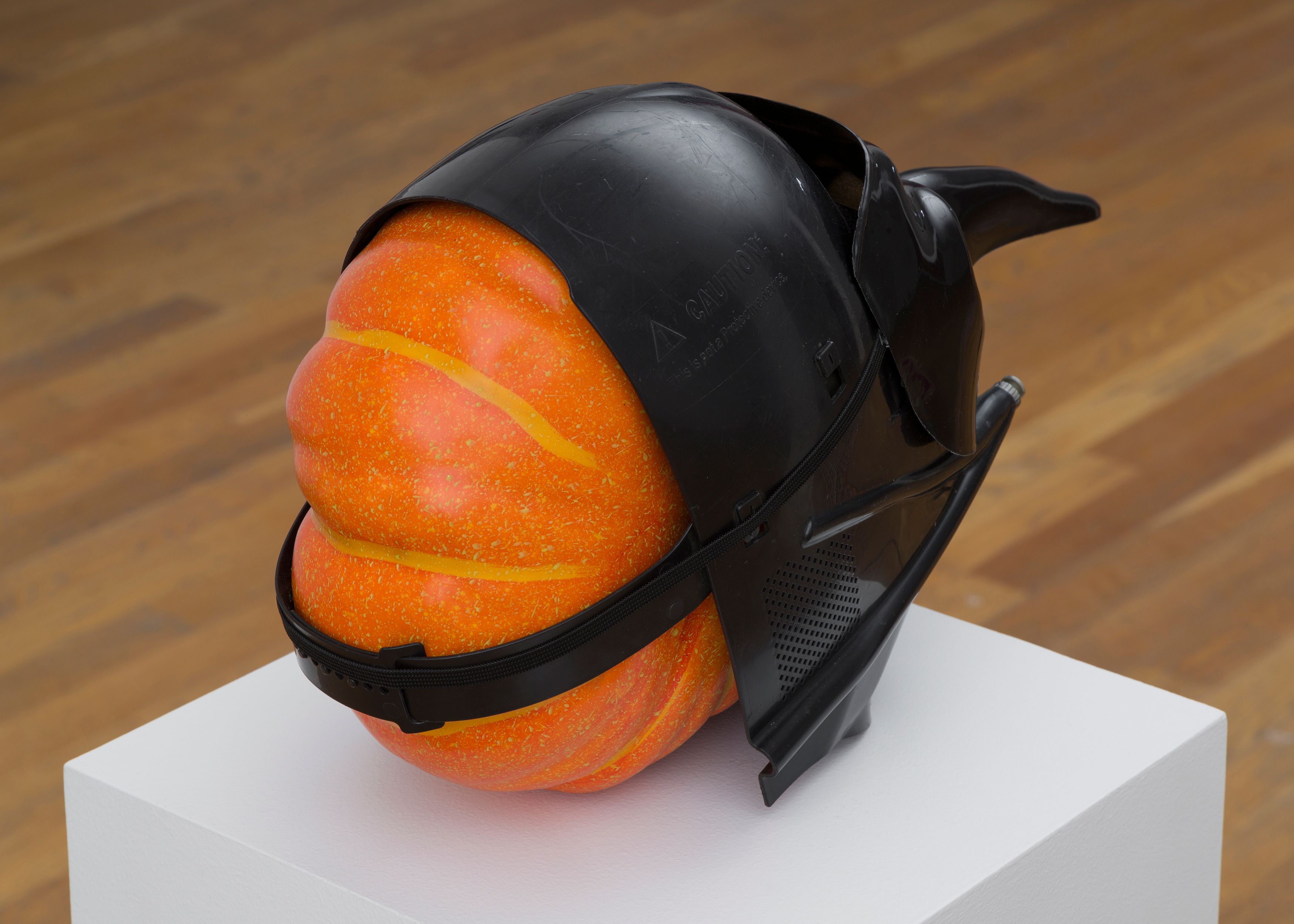 Danny McDonald Pumpkin in a Mask in a Mask, 2017, detail of foam, pumpkin, plastic masks, pedestal, 19 x 8 x 10 in. (48.3 x 20.3 x 25.4 cm), pedestal dimensions: 12 x 12 x 41 in. (30.5 x 30.5 x 104.1 cm) 
